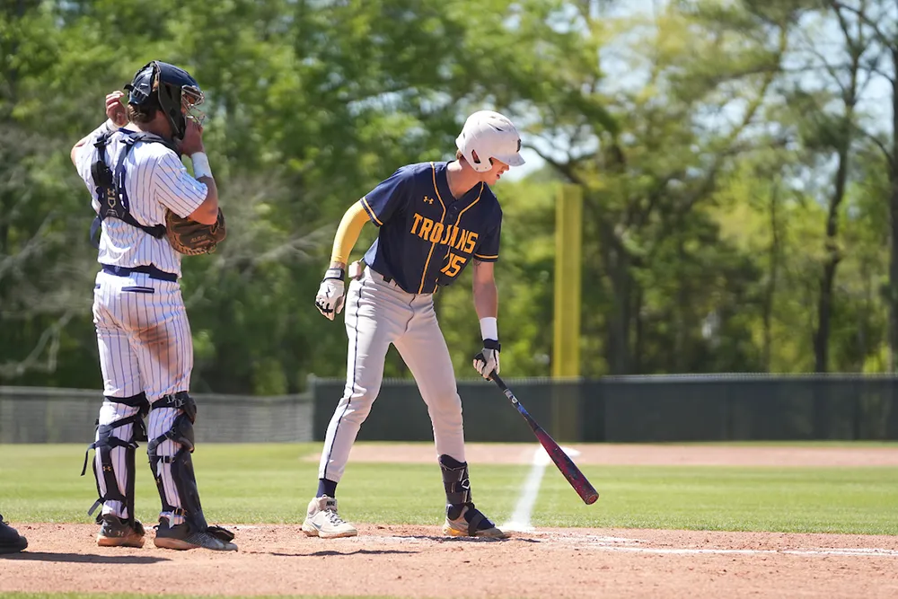 Student playing baseball